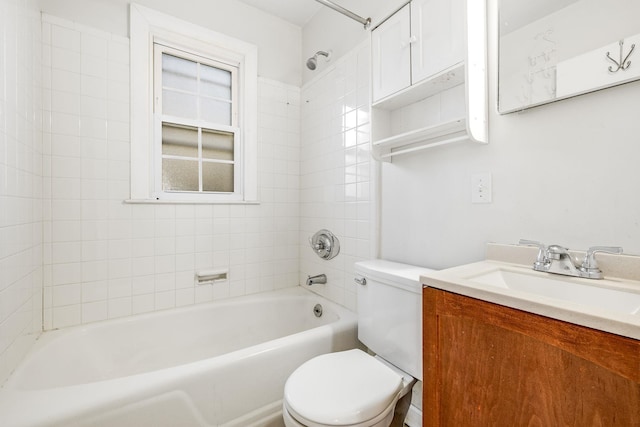 bathroom with toilet, vanity, and bathing tub / shower combination