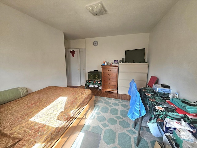 bedroom featuring wood finished floors