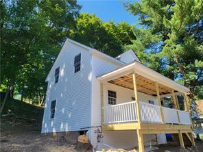 view of home's exterior with a wooden deck