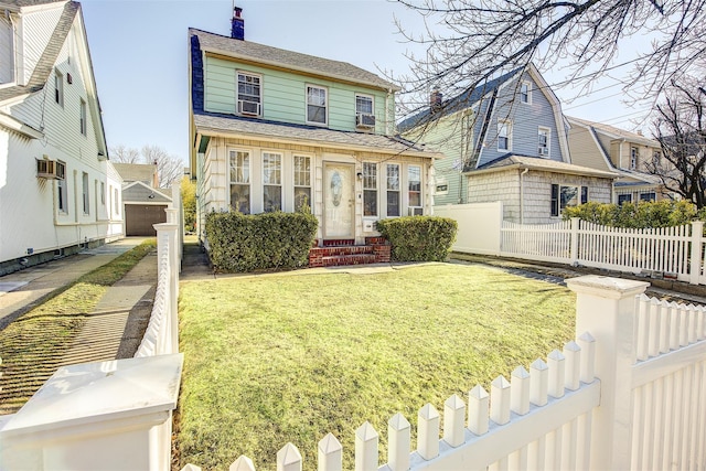 view of front of house featuring entry steps, a chimney, an outbuilding, fence, and a front lawn