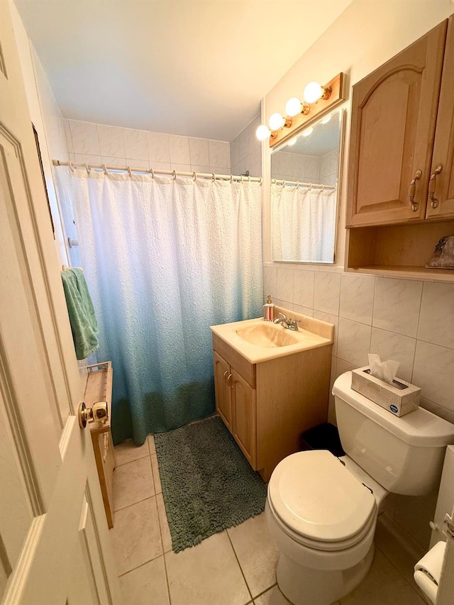 full bath featuring tile walls, toilet, tile patterned flooring, vanity, and backsplash