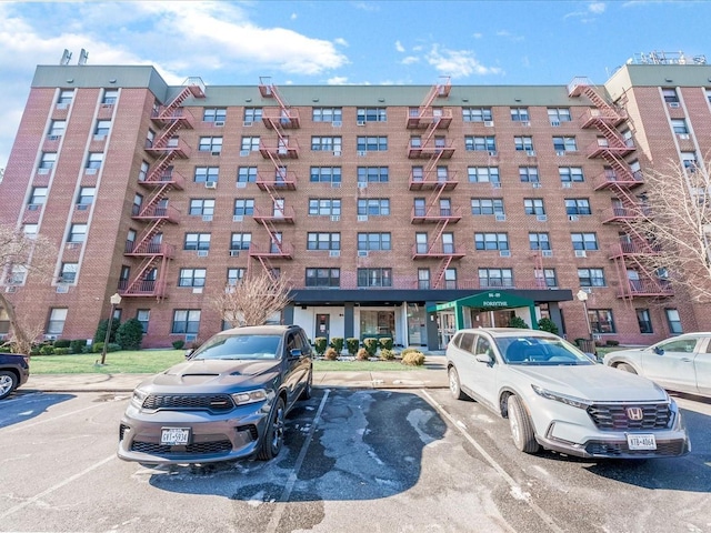 view of property with uncovered parking