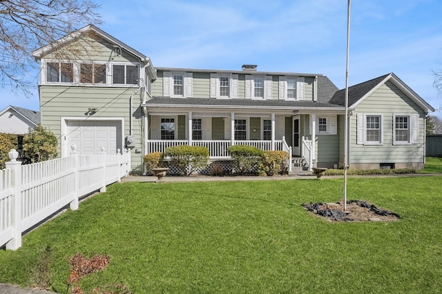 view of front of house featuring a front yard, covered porch, fence, and an attached garage