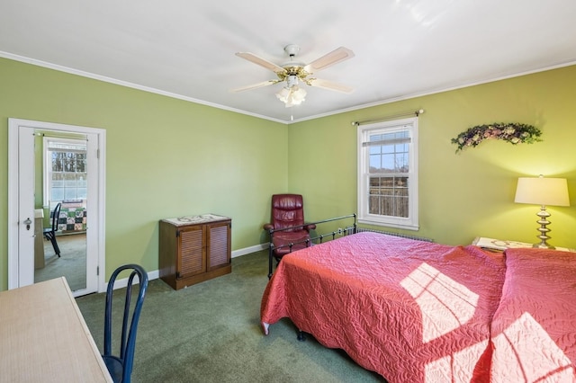 carpeted bedroom featuring baseboards, ornamental molding, and a ceiling fan