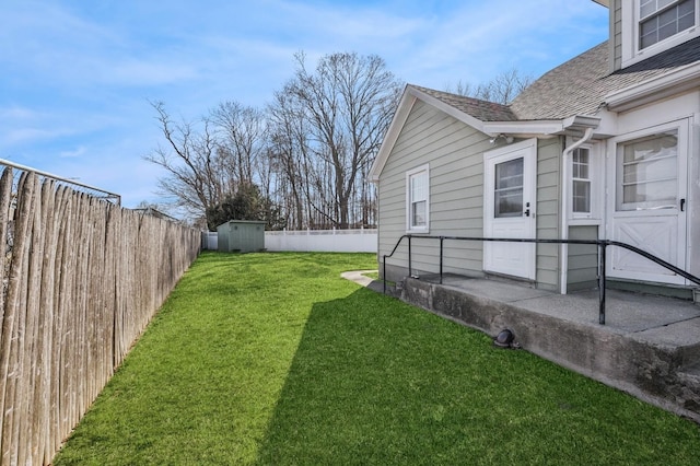 view of yard with a fenced backyard