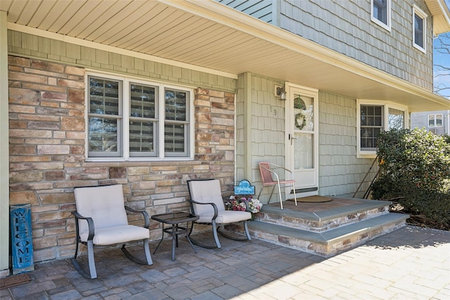 view of exterior entry with stone siding