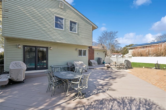 view of patio / terrace featuring outdoor dining area, fence, and grilling area