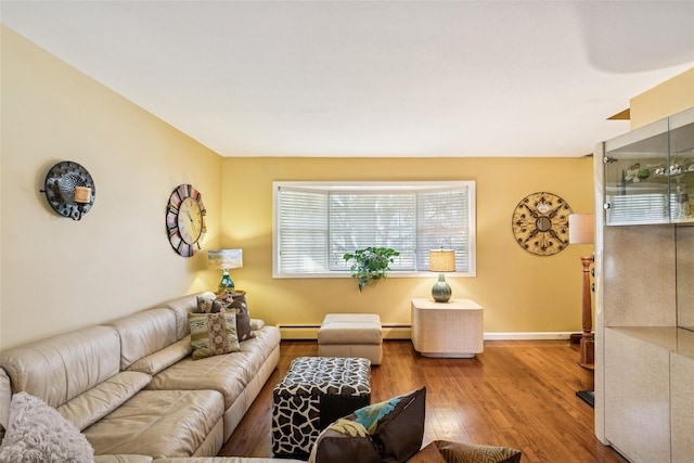 living room featuring a baseboard radiator, wood finished floors, and baseboards