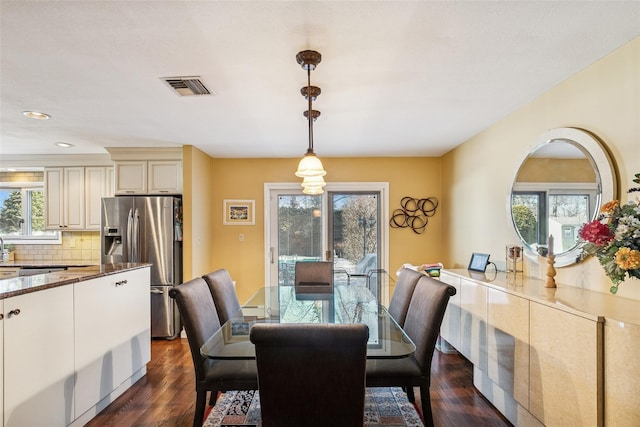 dining space with plenty of natural light, visible vents, dark wood finished floors, and recessed lighting