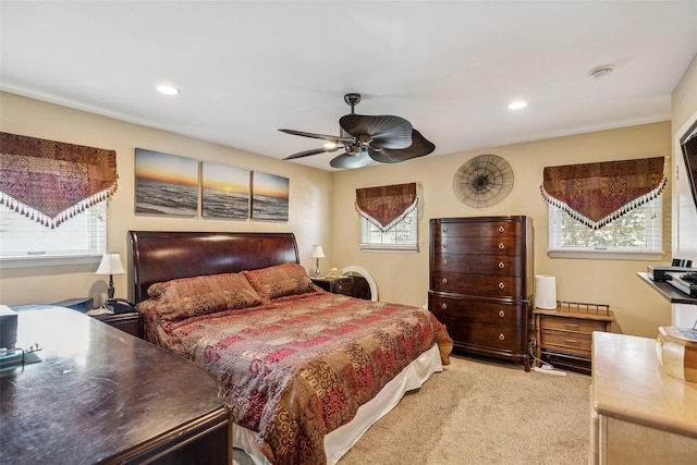 bedroom featuring recessed lighting, light colored carpet, and ceiling fan