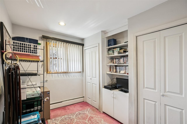 interior space featuring a baseboard radiator and light colored carpet