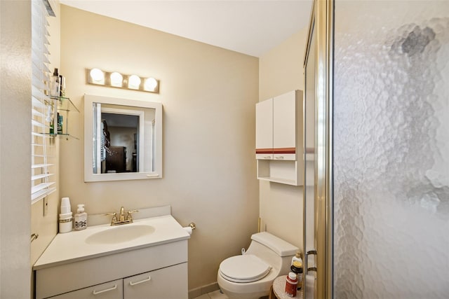 bathroom with toilet and vanity