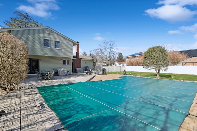 view of pool featuring a fenced in pool, a patio area, and a fenced backyard