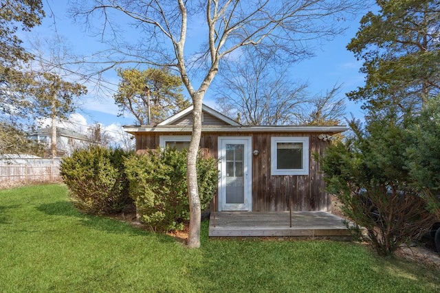 view of outbuilding with an outbuilding and fence