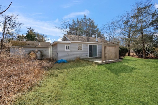 back of house featuring a lawn