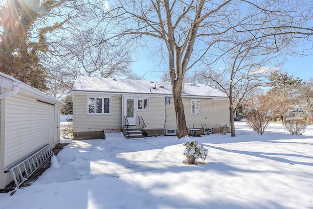 snow covered house with entry steps