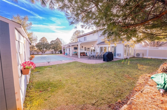 view of yard featuring a patio area, fence, and ac unit