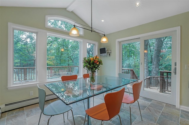 dining area with a baseboard radiator, stone tile flooring, and lofted ceiling with beams