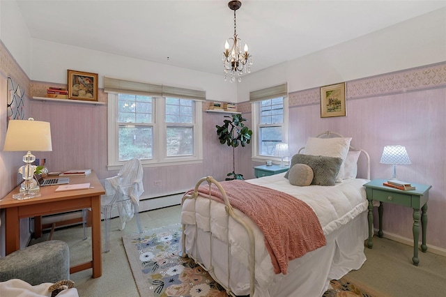 bedroom with baseboards, baseboard heating, carpet flooring, and an inviting chandelier