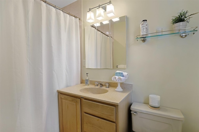 full bath with vanity and toilet