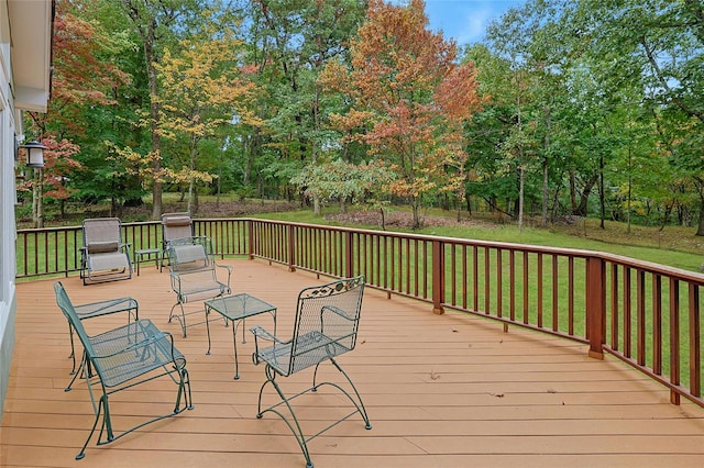 wooden terrace with a yard