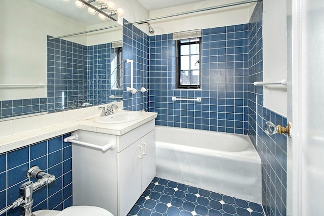 bathroom featuring shower / tub combination, tile walls, and vanity