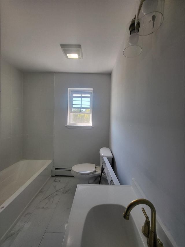 bathroom with toilet, a baseboard radiator, marble finish floor, a bathtub, and a sink