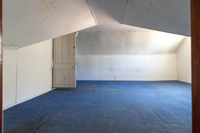bonus room with carpet flooring, baseboards, and lofted ceiling