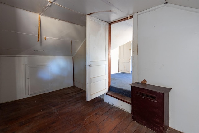 bonus room with dark wood-style floors and lofted ceiling