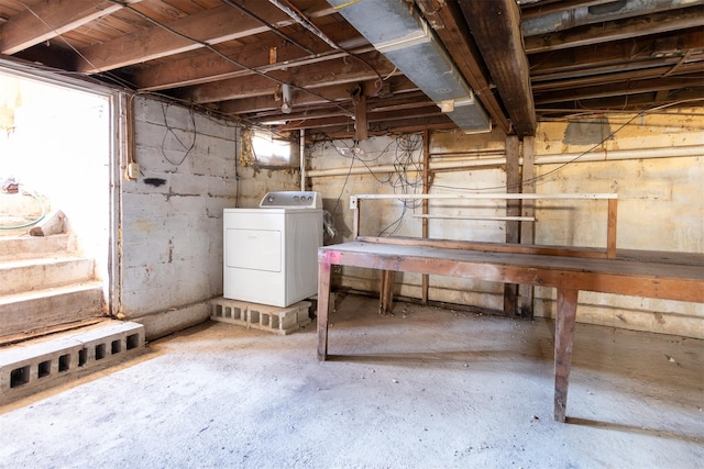 unfinished below grade area featuring washer / clothes dryer