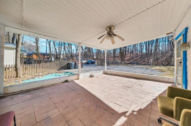 view of patio featuring fence and a ceiling fan