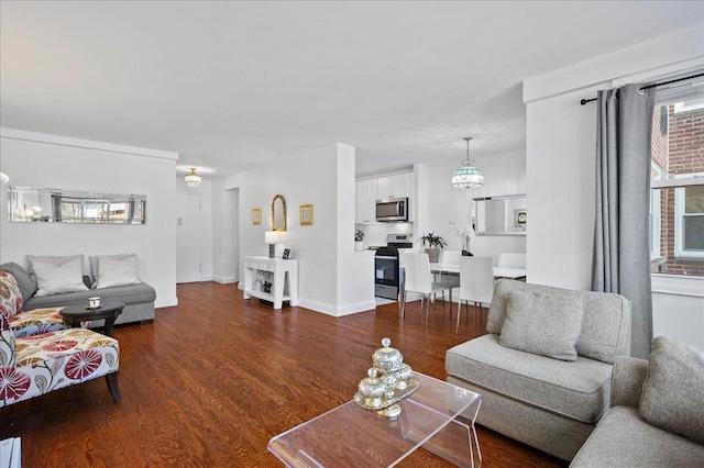 living room featuring dark wood-style floors and baseboards