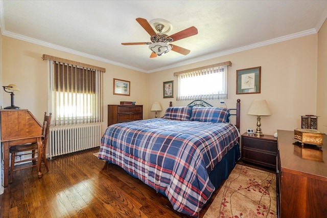 bedroom with radiator heating unit, crown molding, wood finished floors, and a ceiling fan