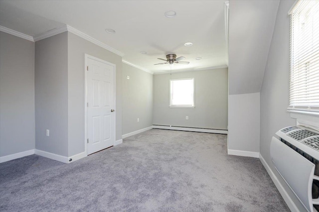 carpeted empty room featuring baseboard heating, baseboards, crown molding, and ceiling fan