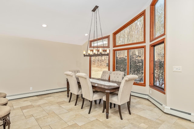 dining space with a baseboard radiator, plenty of natural light, recessed lighting, and an inviting chandelier