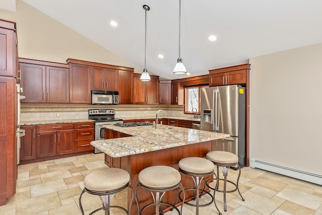 kitchen featuring pendant lighting, a center island with sink, a baseboard radiator, appliances with stainless steel finishes, and light stone countertops