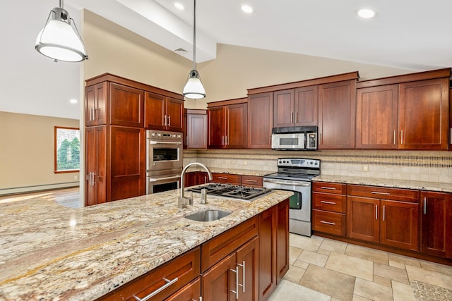 kitchen featuring decorative backsplash, pendant lighting, stainless steel appliances, and a sink