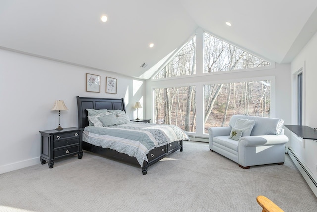 bedroom featuring a baseboard heating unit, high vaulted ceiling, baseboards, and light colored carpet