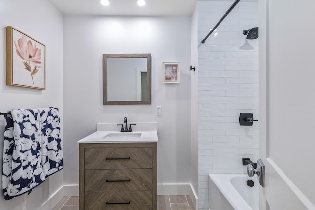 full bathroom featuring  shower combination, recessed lighting, vanity, and baseboards