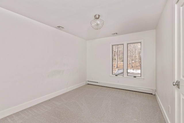 unfurnished room featuring a baseboard heating unit, visible vents, light carpet, and baseboards