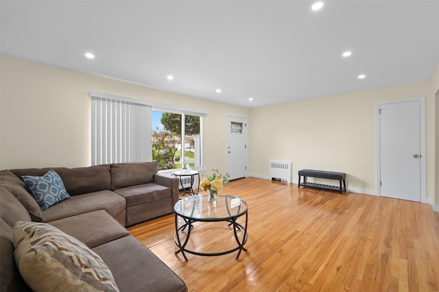 2057 Renfrew Ave, Elmont, NY 11003 - living room with radiator heating unit, light wood-type flooring, recessed lighting, and baseboards