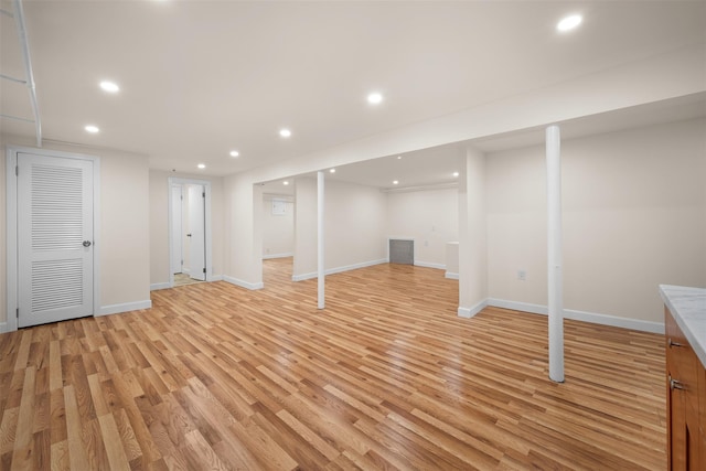 2057 Renfrew Ave, Elmont, NY 11003 - finished basement featuring light wood finished floors, recessed lighting, and baseboards