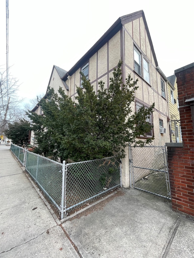 view of home's exterior featuring fence and stucco siding