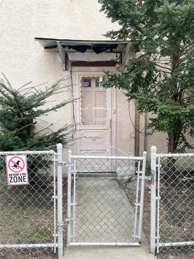 view of gate with fence