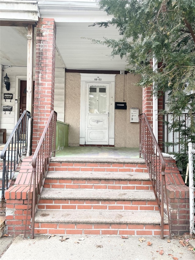 entrance to property with brick siding