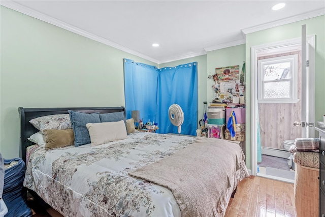 bedroom with a baseboard radiator, light wood-style flooring, crown molding, and recessed lighting