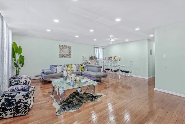 living room featuring baseboards, recessed lighting, a baseboard radiator, and light wood-style floors