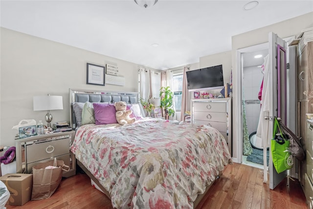 bedroom with wood finished floors