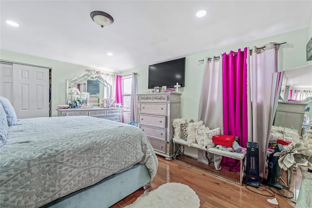 bedroom featuring wood finished floors and recessed lighting