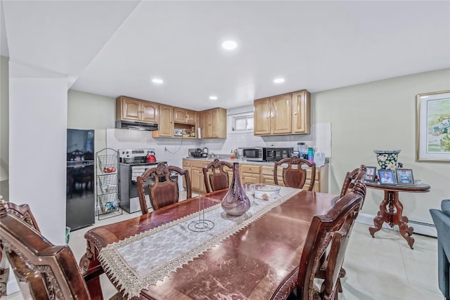 dining space featuring a baseboard heating unit, baseboards, and recessed lighting